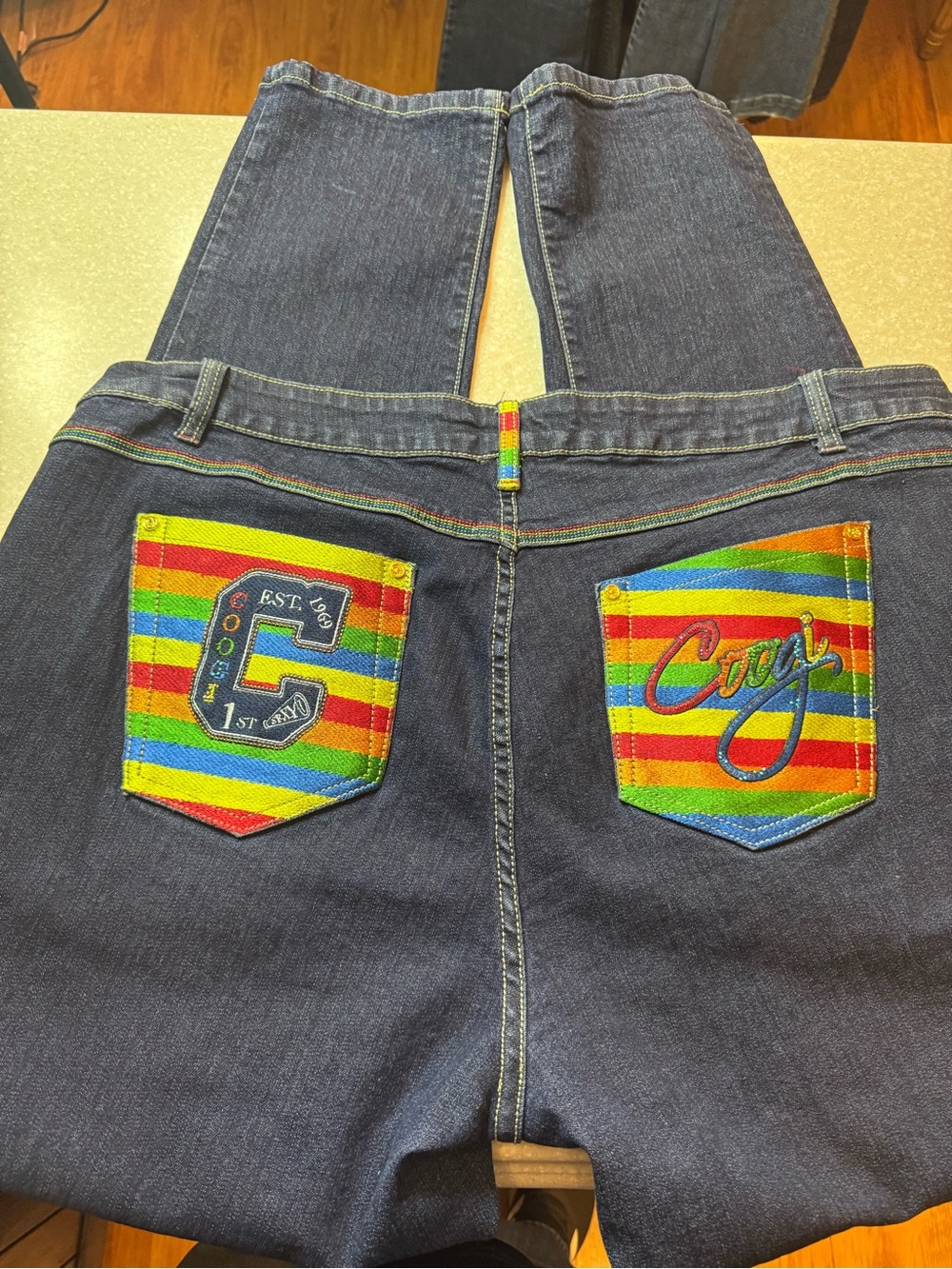 Coogi Jeans.. Rainbow Accent Dark Blue Women’s Jeans with Rainbow Pocket Detail